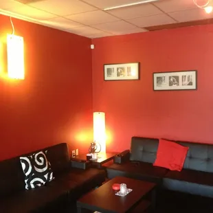 a living room with red walls