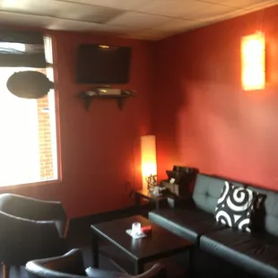 a living room with red walls