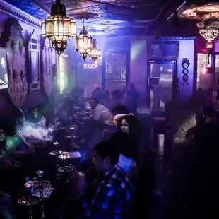 a group of people in a dimly lit room