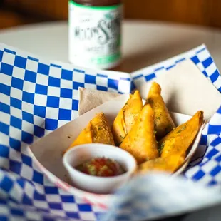 a basket of fries with ketchup