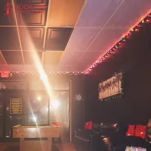 a pool table in the middle of the room