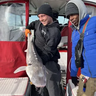 Me and boy on a Slot size sturgeon