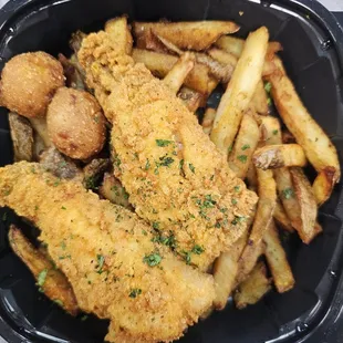 Perch dinner complete with hush puppies and fries.