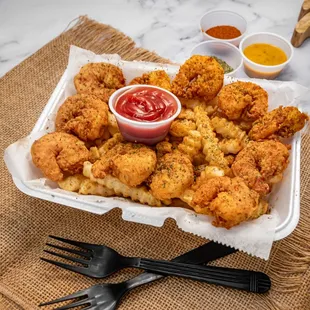 a tray of fried shrimp with a side of ketchup