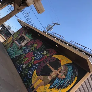 a woman in a bikini on the side of a building