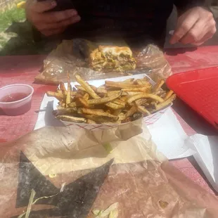 Regular burger (closest) fries and double burger.