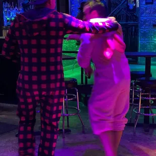 a man and a woman dressed in pajamas