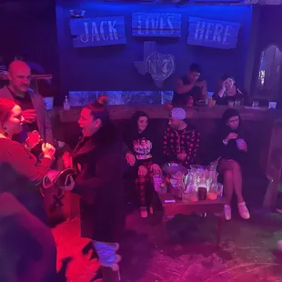 a group of people sitting around a table