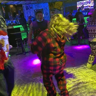 a woman in plaid pajamas dancing