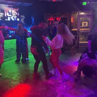 a group of people dancing at a party