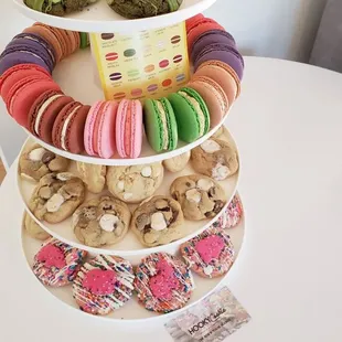 a three tiered display of macarons