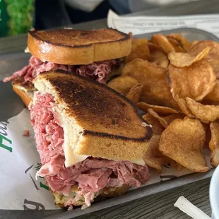a roast beef sandwich and chips