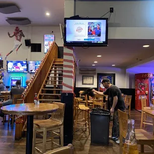 a man serving a beer