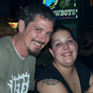 a man and a woman at a bar