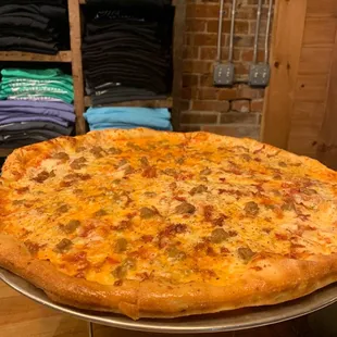 a large pizza on a tray