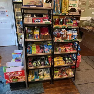 a little boy looking at the shelves