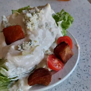 Wedge salad with tons of blue cheese dressing and deep fried pork belly
