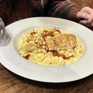 Chicken Mac &amp; Cheese - breaded or grilled, (added bacon), usually with BBQ or hot sauce. Comes with soup or salad.