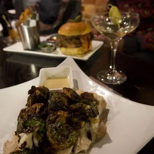 The Branzino Fish with the crispy roasted Brussels sprouts and The Wagyu burger