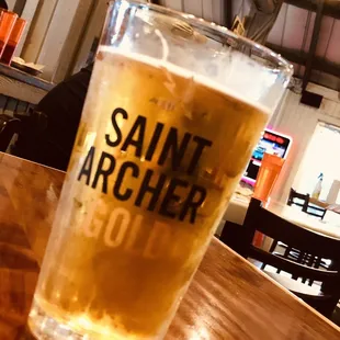 a glass of beer on a table