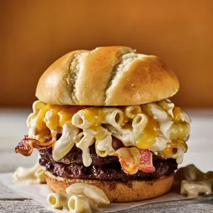 a hamburger with macaroni and cheese