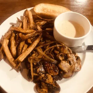 Hamburger Steak with sautéed onions, mushrooms and gravy with French fries and toast
