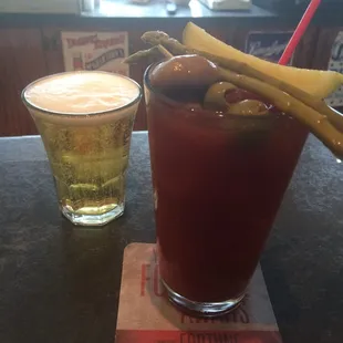 a bloody drink and a glass of beer