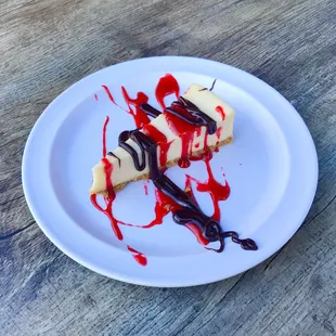 cheesecake with raspberry and chocolate drizzle