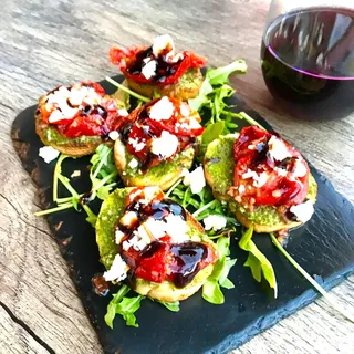 Marinated Tomato and Pesto Crostini