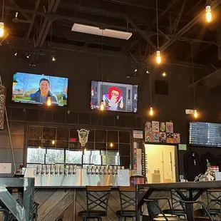 a bar with a large screen tv