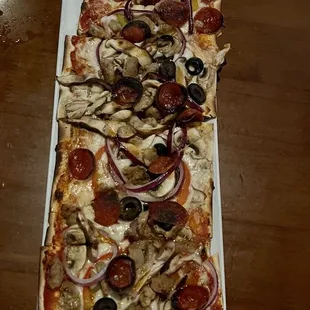 Supreme Flatbread. (discounted on happy hour) Very balanced combo of veggies and meats, unlike most. Love the two types of mushrooms!!