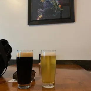 two glasses of beer on a table