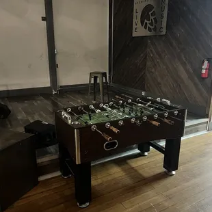 Foosball table and a stage. I wonder if they do karaoke?
