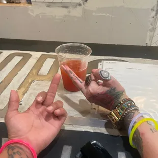 two people holding up their fingers