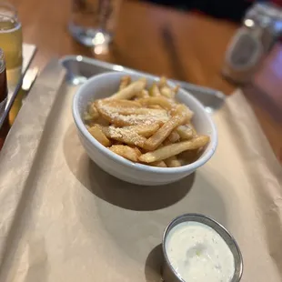 a bowl of fries and dip