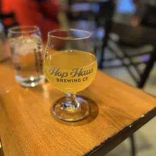 a glass of beer on a table