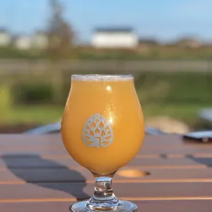 a glass of beer on a table