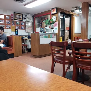 a man sitting at a table in a restaurant