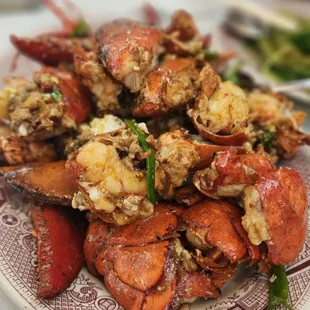 a plate of cooked lobsters