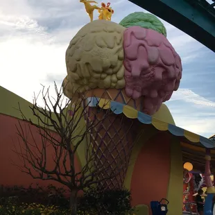 a giant ice cream cone in front of a building