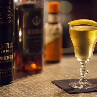 a glass of wine and a bottle of liquor