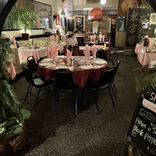 a dining room with tables and chairs