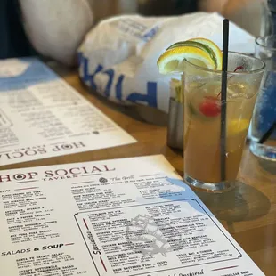 a menu and a drink