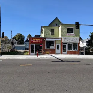 the corner of a street in front of a building