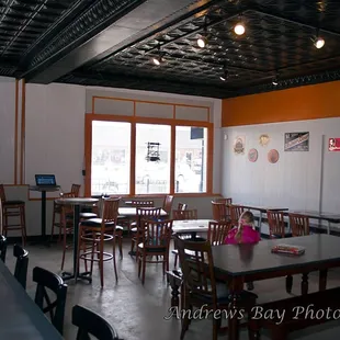 a classroom with tables and chairs