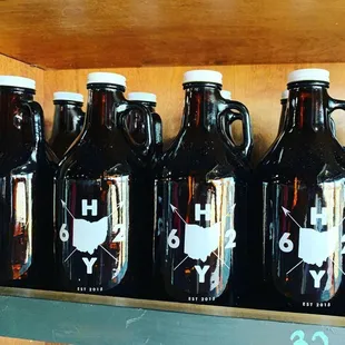 a row of beer bottles on a shelf