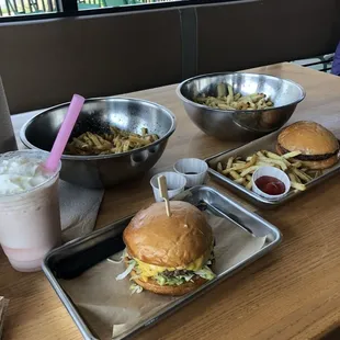 Cheeseburger, kids burger, fries and a strawberry shake