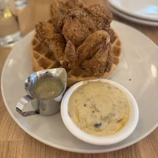 Southern Fried Chicken &amp; Waffles with amazing sausage and mushroom gravy and jalapeño maple syrup