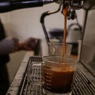 a espressor being poured into a cup