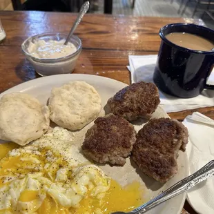 Over easy eggs, sausage and biscuits gravy... cup of coffee too. Outstanding place to eat, best sausage around boss is a hoot